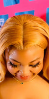 Below (model) honey blonde 22 inch straight - Billionaire Beauty by Cee